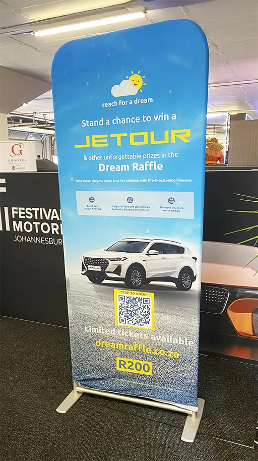 A sock banner at The Festival of Motoring printed for Reach For a Dream by Brand Monster