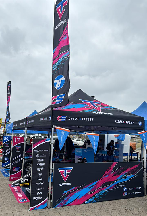 Telescopic banners as part of a display with branded gazebos for CS Racing